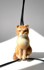 Handmade realistic ginger wool cat sculpture charm in sitting pose, detailed close look, needle-felted with lifelike details. 