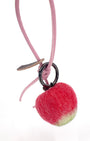Back view of soft Merino wool apple fruit charm attached to a pastel pink leather loop, showing the textured red-to-green gradient.