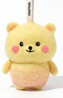 Front view of a handmade Woobbi bear keychain, crafted from yellow and pink bubbly wool felt. It has small yellow ears, rosy pink cheeks, and a smiling face with black eyes and nose. A small tag with the brand name 'Woobbi' is attached to the top. It is set against a plain white background.