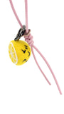 Cute winking lemon fruit charm made of Merino wool, attached to a pastel pink leather strap and displayed on a white background.