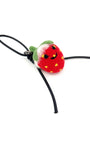 Studio shot of needle-felted wool strawberry bag charm featuring a black leather cord and cute smiley face, isolated on a white background.