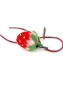 Side view of soft needle-felted strawberry fruit charm attached to a red leather strap with a brown Woobbi brand tag.