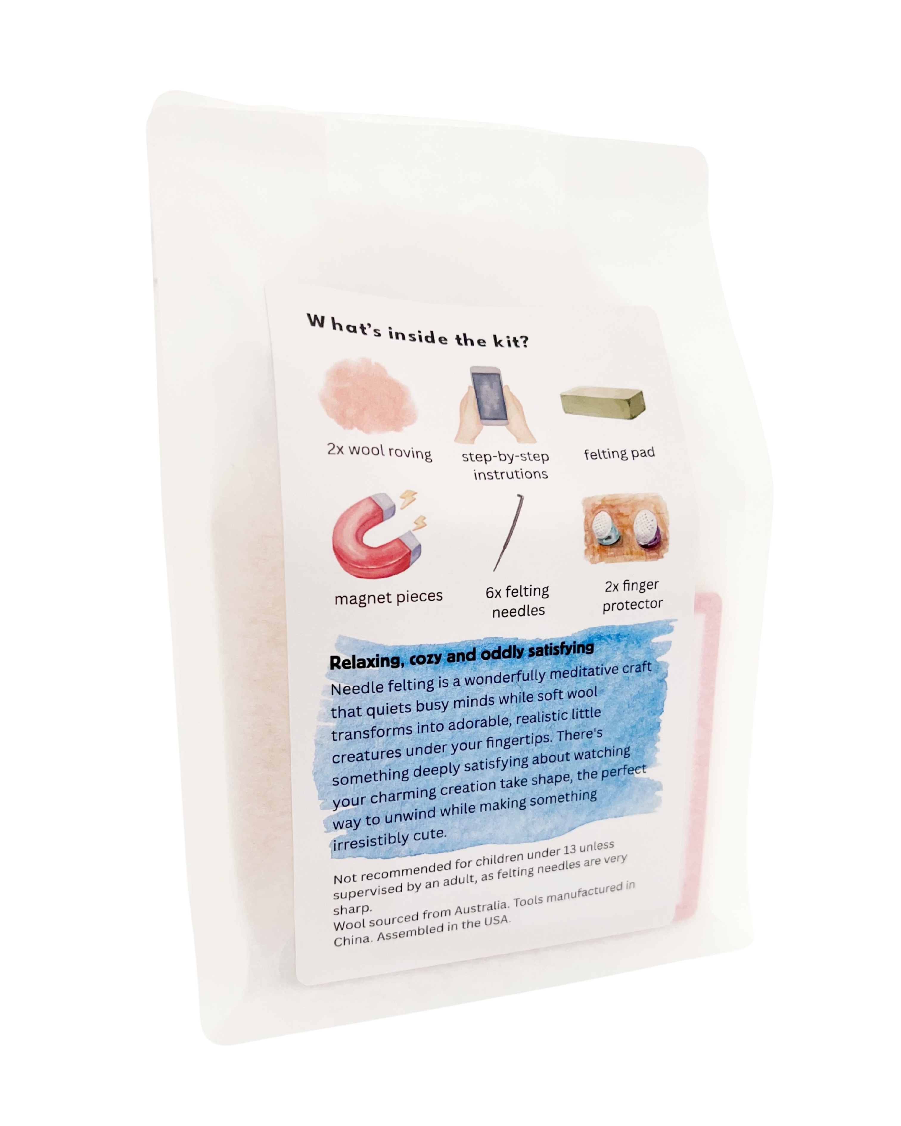 Back of wool felting kit showing included materials: merino wool roving, felting pad, needles, magnet pieces and finger protectors