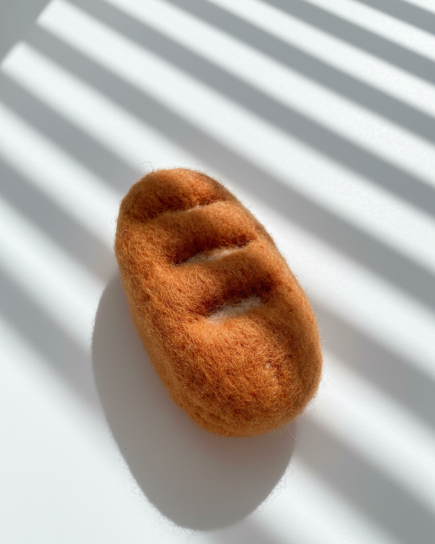 Natural wool baguette magnet handmade with dense needle-felted construction