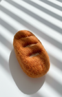 Natural wool baguette magnet handmade with dense needle-felted construction