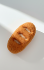 Handcrafted wool baguette magnet inspired by a classic French bread loaf
