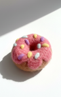 Pink donut wool magnet with sprinkle details, handmade needle-felted food magnet