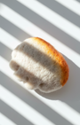 Small handmade wool dumpling magnet inspired by pan-fried jianjiao