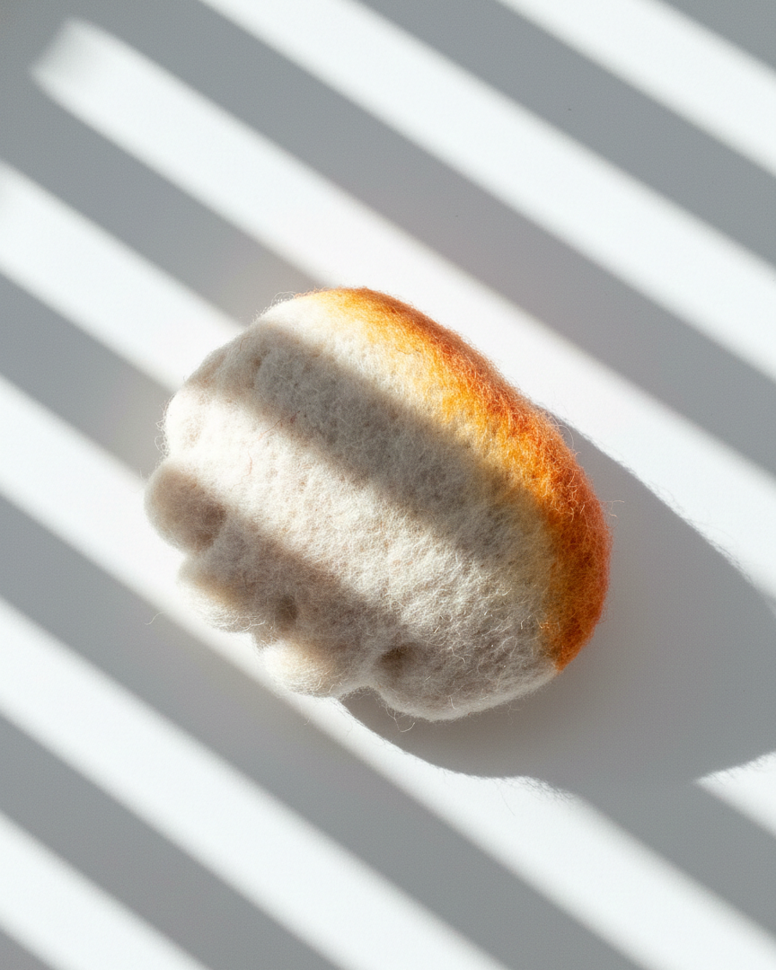 Small handmade wool dumpling magnet inspired by pan-fried jianjiao