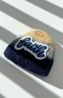 Handcrafted merino wool fridge magnet featuring Faith embroidery patch, blue gradient felt texture