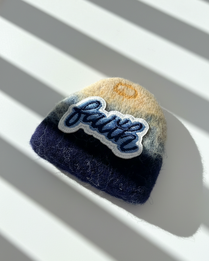 Handcrafted merino wool fridge magnet featuring Faith embroidery patch, blue gradient felt texture