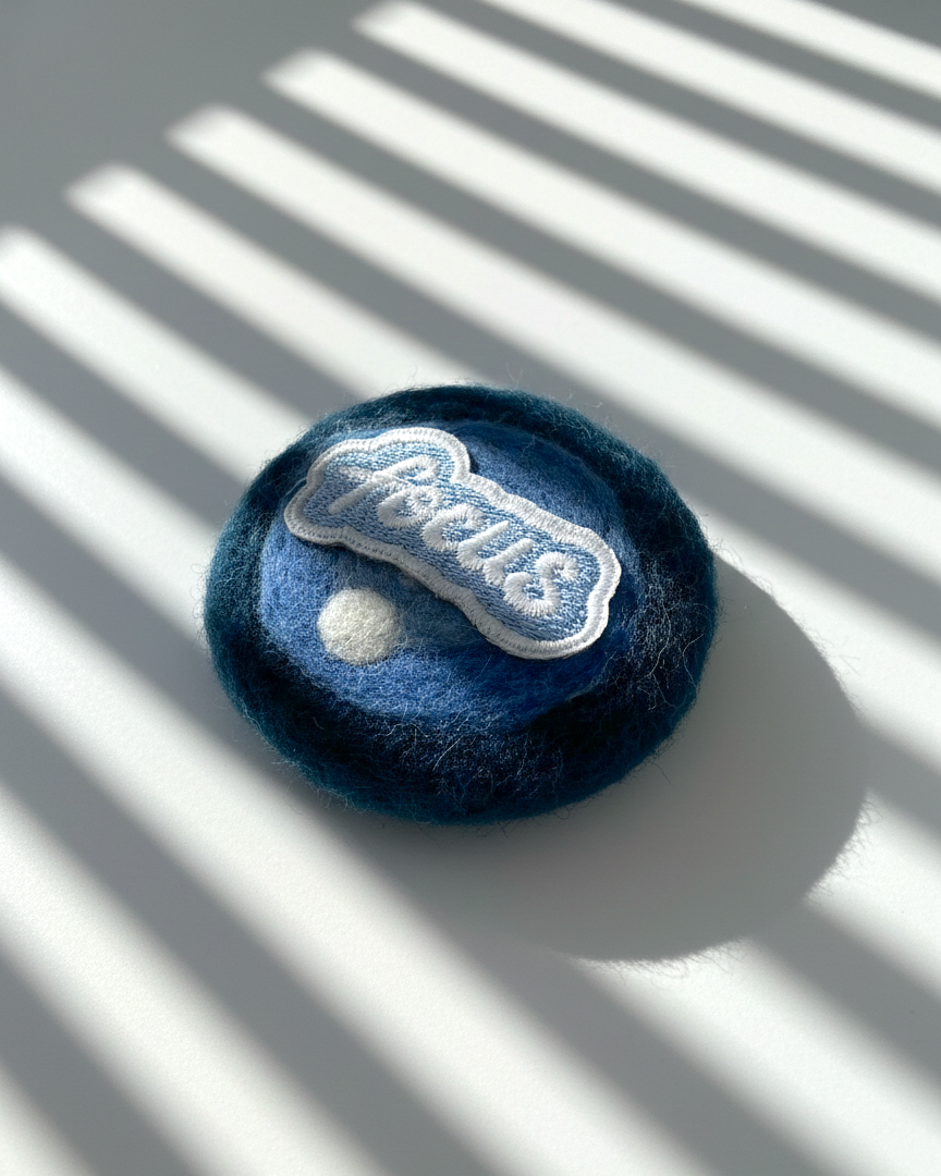 Minimalist blue wool fridge magnet, round needle-felted merino wool with Focus patch, modern handmade home decor