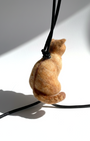 Handmade realistic ginger wool cat sculpture charm in sitting pose, back view, needle-felted with lifelike details, white background