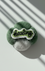 Handmade green wool fridge magnet with embroidered Healing patch, needle-felted merino wool decor