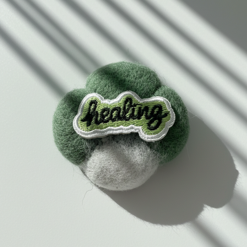 Handmade green wool fridge magnet with embroidered Healing patch, needle-felted merino wool decor