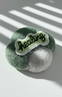 Green needle-felted wool magnet with Healing embroidery patch, soft rounded clover shape
