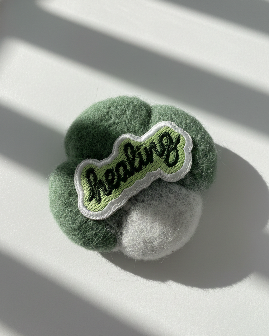 Minimalist green wool fridge magnet featuring Healing patch, handmade felt home decor