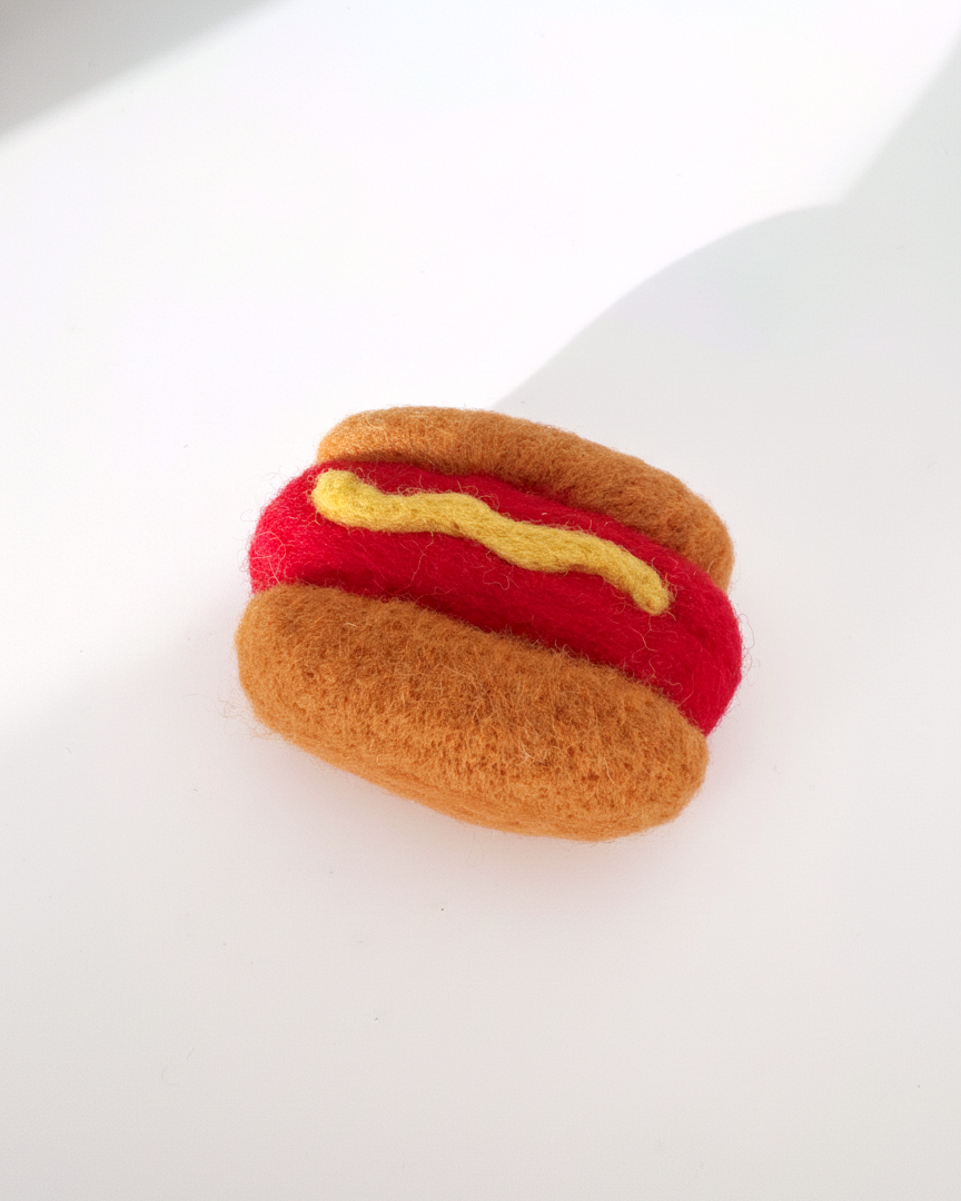 Wool hot dog magnet handmade with needle-felted construction and soft dense texture