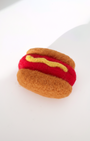 Wool hot dog magnet handmade with needle-felted construction and soft dense texture