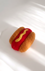 Handmade hot dog wool magnet, needle-felted with soft texture and classic color contrast