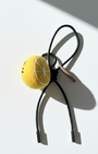 Artisan felted lemon slice accessory with black leather cord and silver hardware.