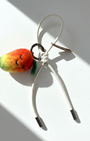 Handmade smiley face mango felt charm with cream white cord and metal tips.