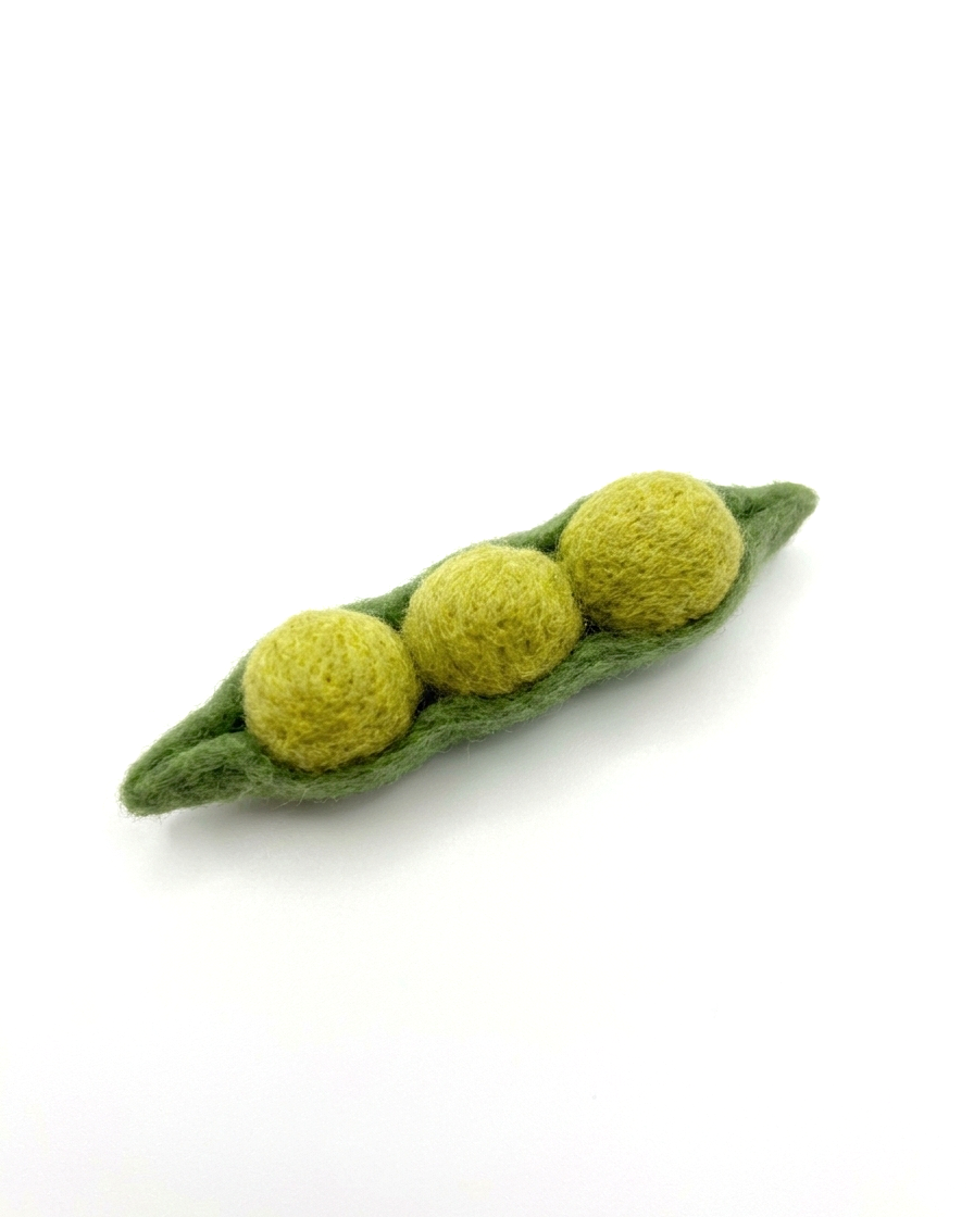 Felted green pea pod with three peas on a white background