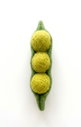 Felted three-section pod with three balls of yarn on a white background