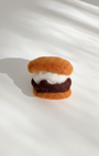 Small handmade s’more wool magnet featuring marshmallow and chocolate filling