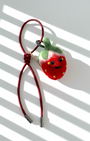Wool felt strawberry bag charm with red leather loop, handcrafted fruit keychain accessory