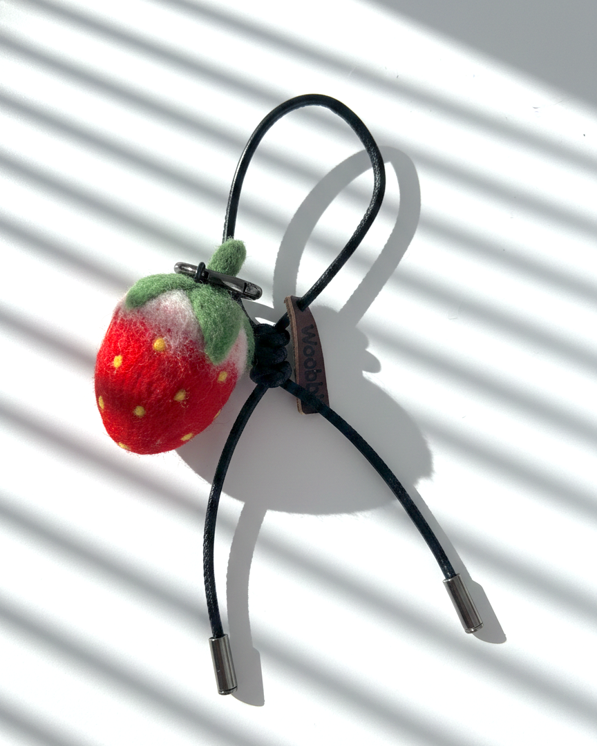 Handmade needle-felted strawberry keychain with black leather loop and metal ring