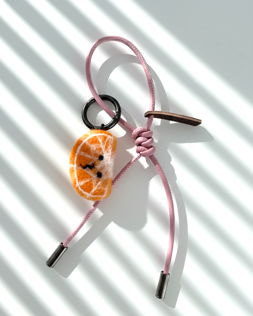 Wool felt tangerine slice bag charm with pink leather strap, handmade citrus keychain