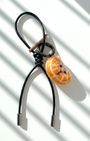 Handmade wool felt tangerine slice keychain with black leather loop, needle-felted citrus bag charm