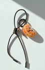 Wool felt citrus slice charm with olive leather loop, handmade fruit keychain accessory