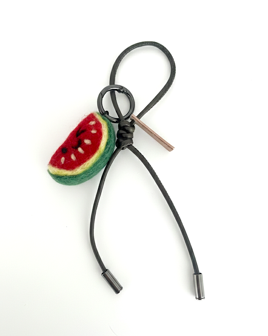 Handmade wool felt watermelon slice keychain with olive leather loop, needle-felted fruit bag charm