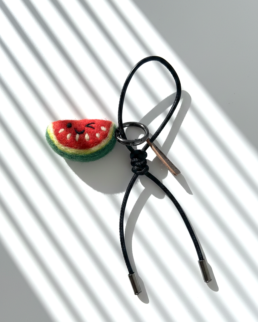 Needle felt watermelon slice charm with black leather strap, handmade wool fruit keychain